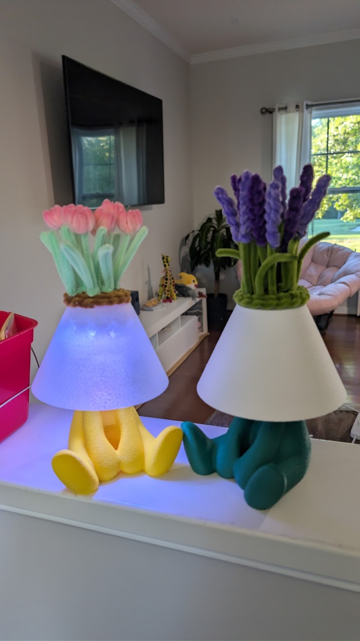 Pink tulip and lavender floral lamps side by side